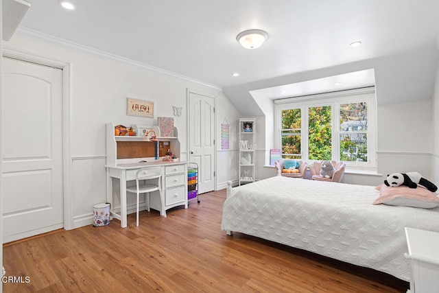 bedroom with ornamental molding and wood-type flooring