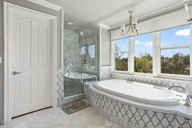 bathroom with plus walk in shower and an inviting chandelier