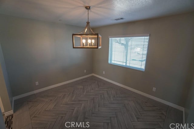 empty room featuring dark parquet floors