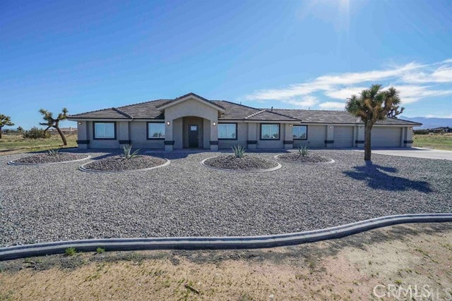 ranch-style house featuring a garage