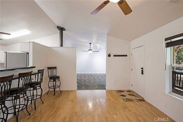 14331 Troy Way, Magalia, CA 95954 - foyer featuring baseboards, vaulted ceiling, light wood-style flooring, and a ceiling fan