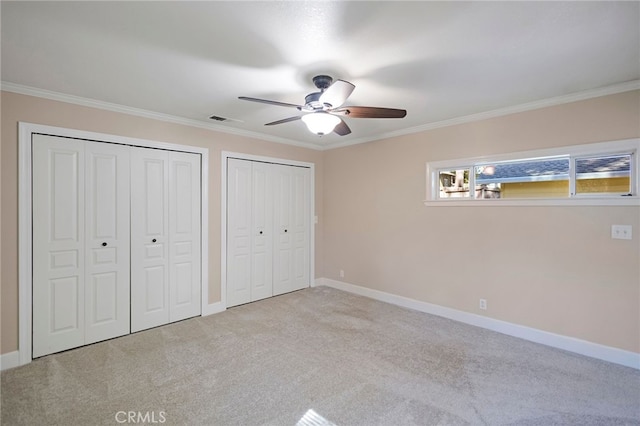 14331 Troy Way, Magalia, CA 95954 - unfurnished bedroom with baseboards, multiple closets, visible vents, and carpet