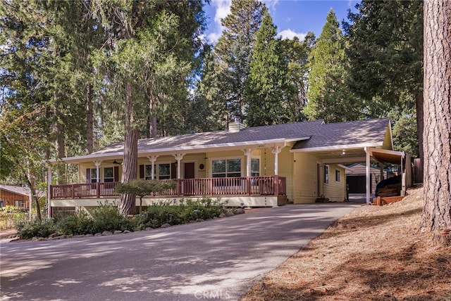 14331 Troy Way, Magalia, CA 95954 - ranch-style house featuring a chimney, aphalt driveway, covered porch, roof with shingles, and a carport