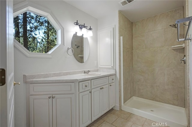 14331 Troy Way, Magalia, CA 95954 - full bath with vanity, visible vents, tile patterned flooring, and a tile shower