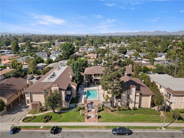 birds eye view of property with a mountain view