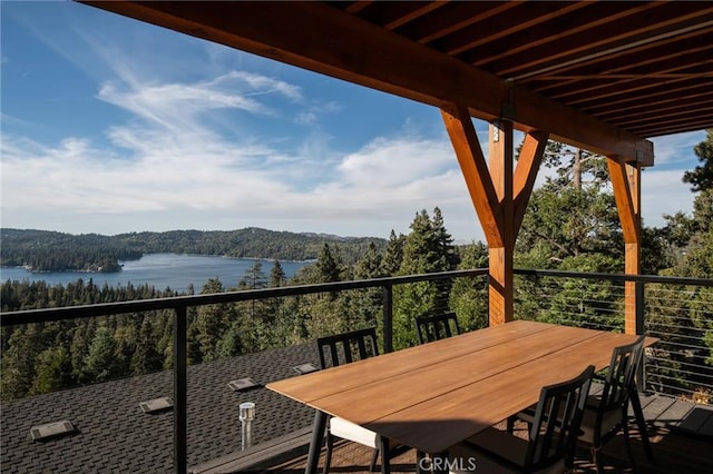 balcony featuring a water view