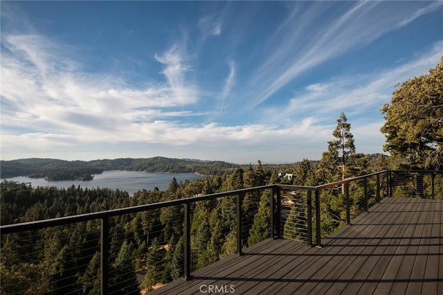 wooden deck with a water view