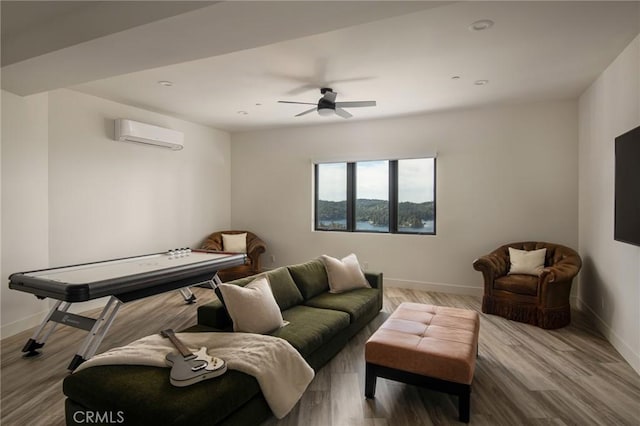 living room with a wall unit AC, ceiling fan, and hardwood / wood-style flooring