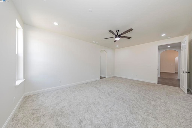 empty room with light carpet and ceiling fan