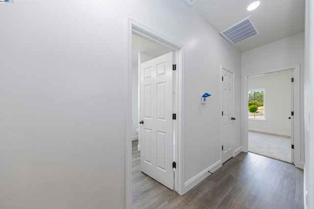 hall featuring dark wood-type flooring