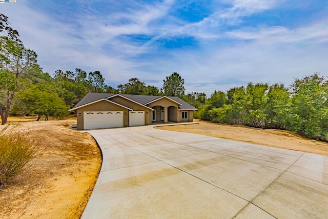 ranch-style home with a garage