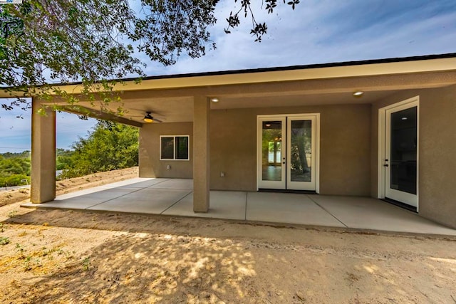 rear view of property featuring a patio and ceiling fan