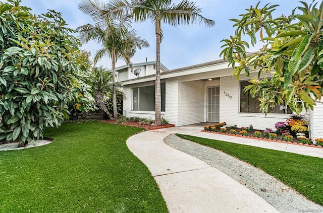 view of front of home with a front yard