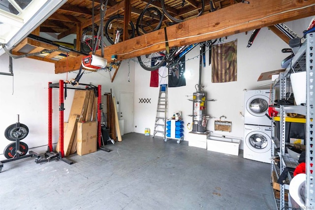 garage featuring a garage door opener, water heater, and stacked washer and dryer