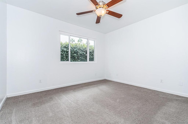 spare room with carpet and ceiling fan