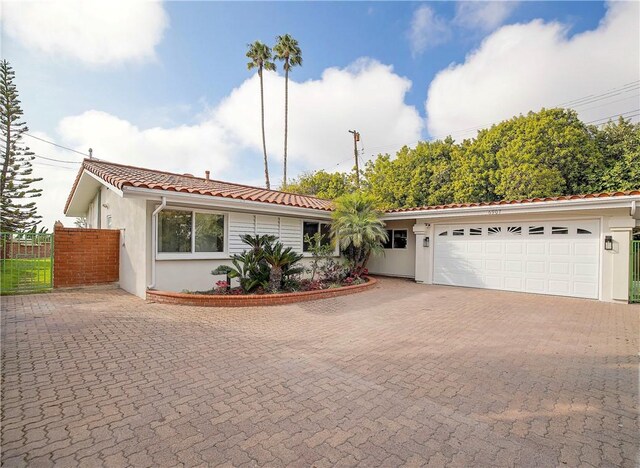 ranch-style house featuring a garage