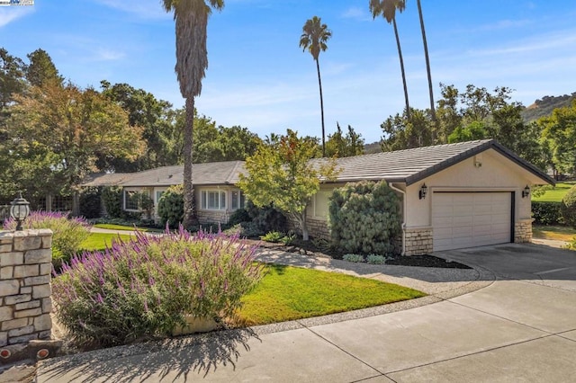 ranch-style home featuring a garage