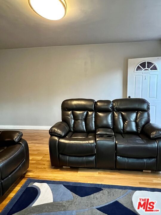 home theater with hardwood / wood-style flooring