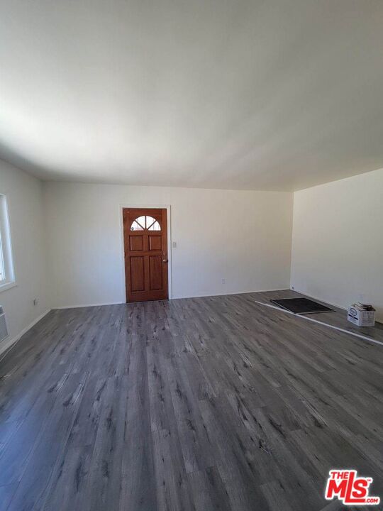 foyer with dark hardwood / wood-style floors