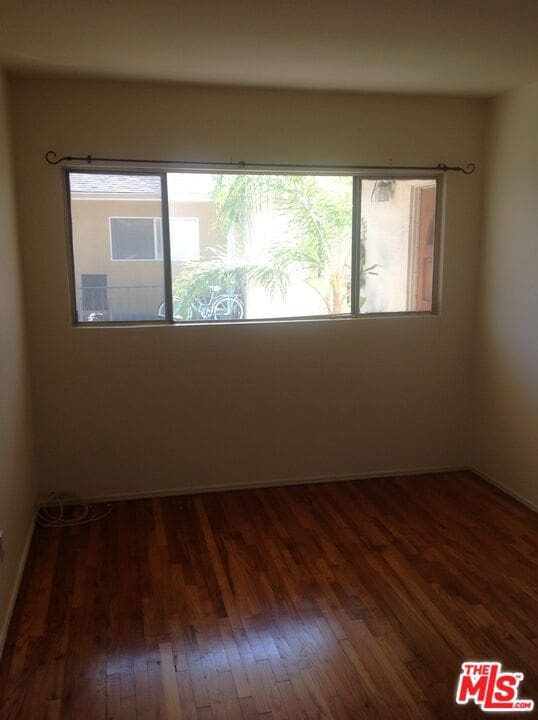 empty room featuring dark hardwood / wood-style floors