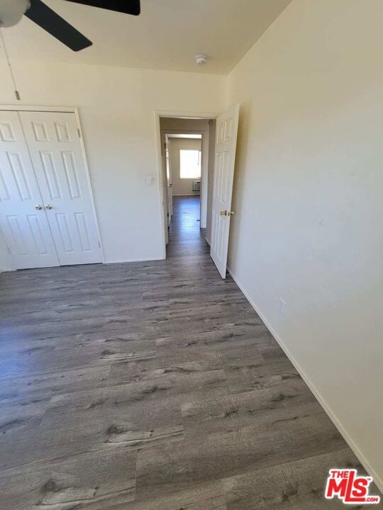 hall with dark hardwood / wood-style flooring