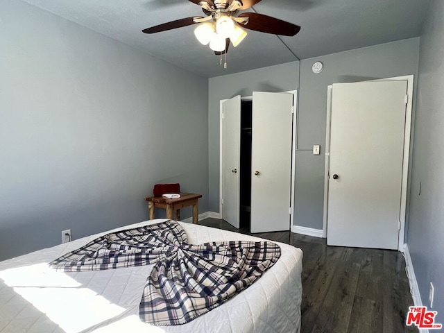 bedroom featuring dark hardwood / wood-style flooring and ceiling fan