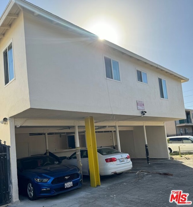 exterior space featuring a carport