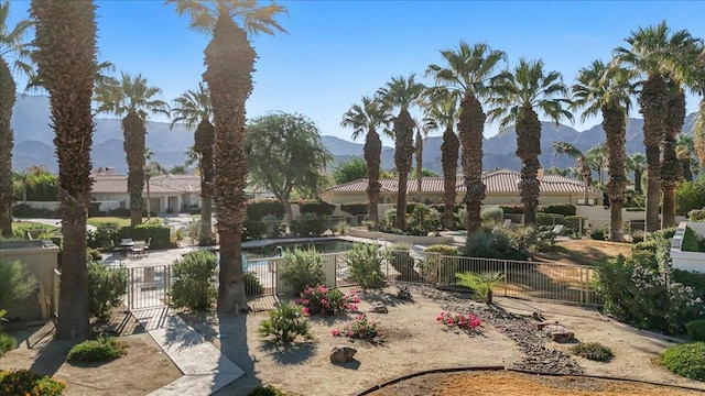 view of property's community with a mountain view and a pool