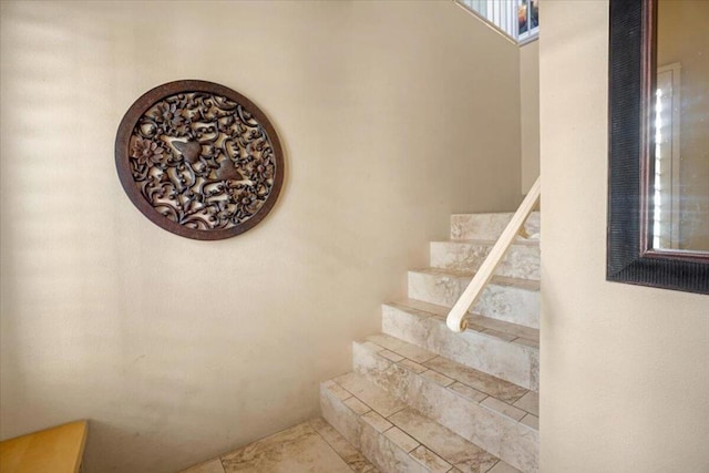 staircase with tile patterned floors