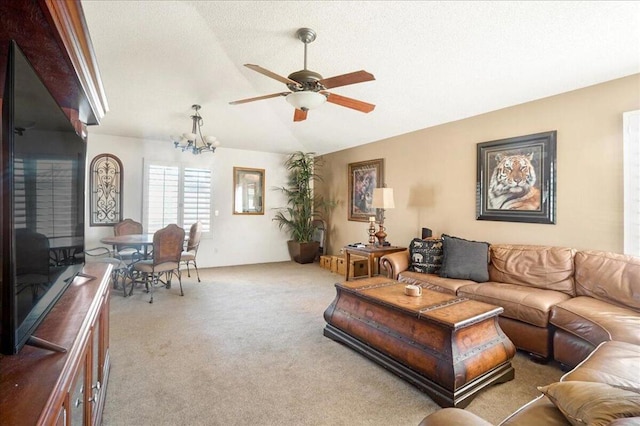 living room with light colored carpet and ceiling fan with notable chandelier