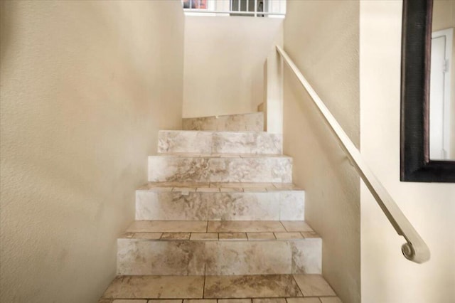 staircase with tile patterned flooring