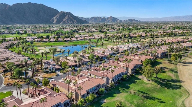 bird's eye view with a water and mountain view