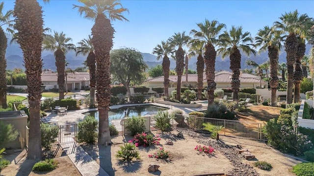 view of pool with a patio and a mountain view