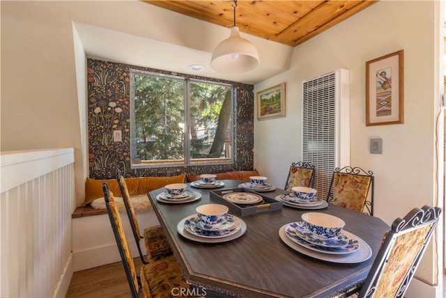 dining room featuring wooden ceiling and hardwood / wood-style floors