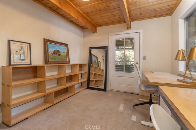 office with light carpet, beamed ceiling, wooden ceiling, and built in desk