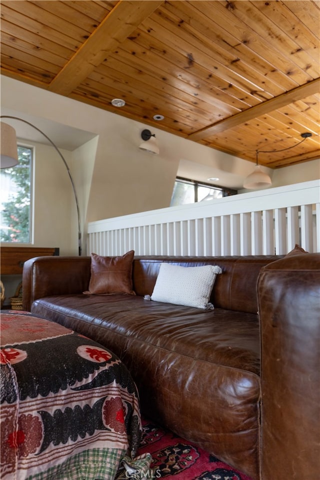 living room with wood ceiling and beamed ceiling