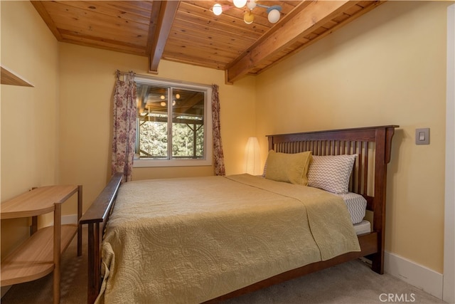 carpeted bedroom with beam ceiling and wooden ceiling