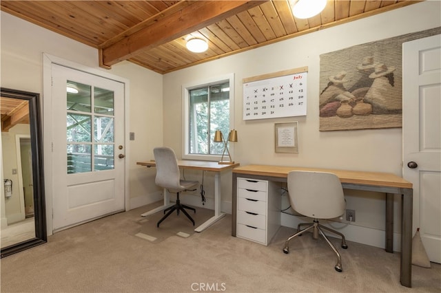 home office with light carpet, beamed ceiling, and wooden ceiling