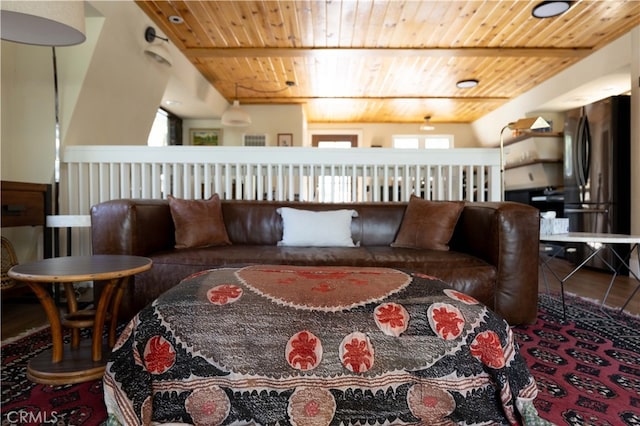 living room featuring hardwood / wood-style floors and wooden ceiling