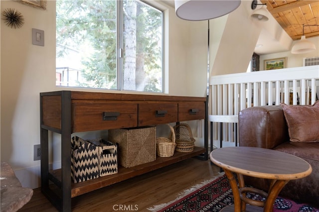 sitting room with wood ceiling, a healthy amount of sunlight, lofted ceiling, and dark hardwood / wood-style flooring