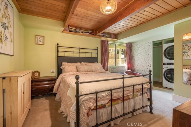 carpeted bedroom featuring wood ceiling, beam ceiling, and stacked washer / drying machine