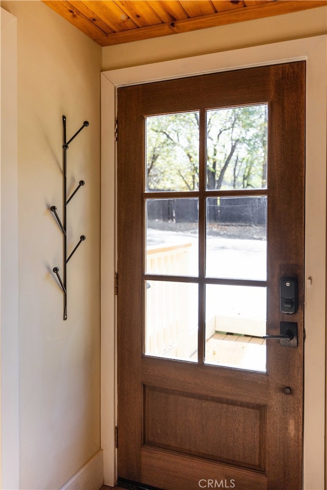 doorway featuring wooden ceiling