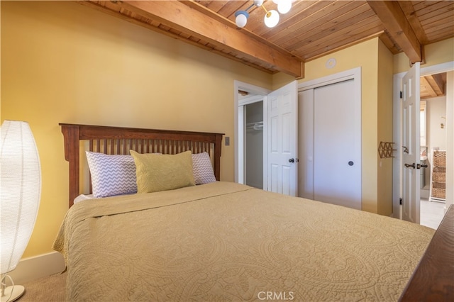 unfurnished bedroom with carpet flooring, wooden ceiling, and beamed ceiling