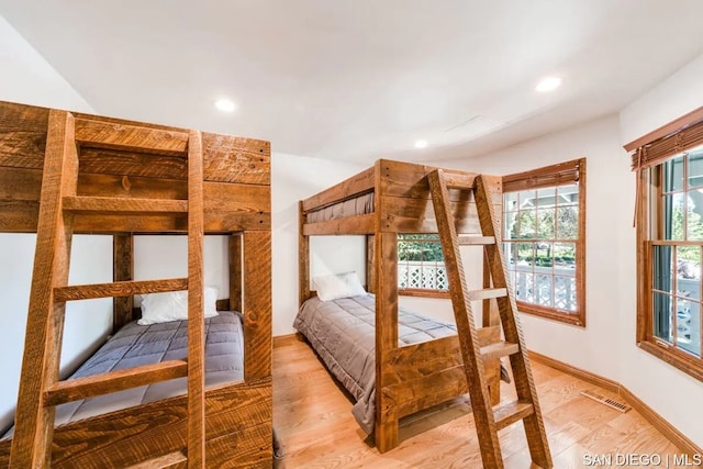 bedroom with hardwood / wood-style flooring