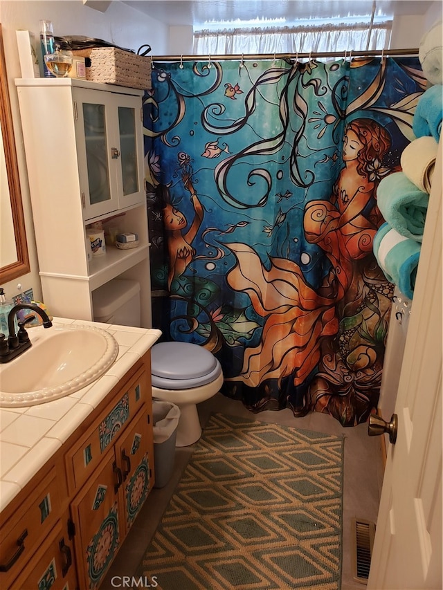 bathroom featuring vanity, a shower with curtain, and toilet