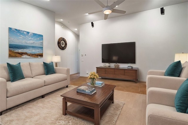 living room with ceiling fan and light hardwood / wood-style floors