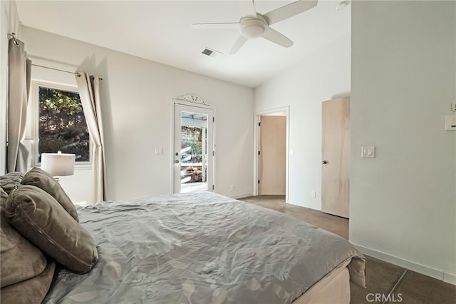 bedroom featuring ceiling fan, lofted ceiling, and multiple windows