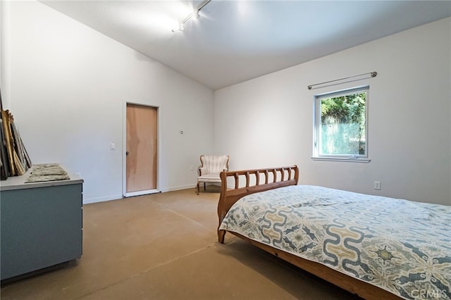 carpeted bedroom with vaulted ceiling