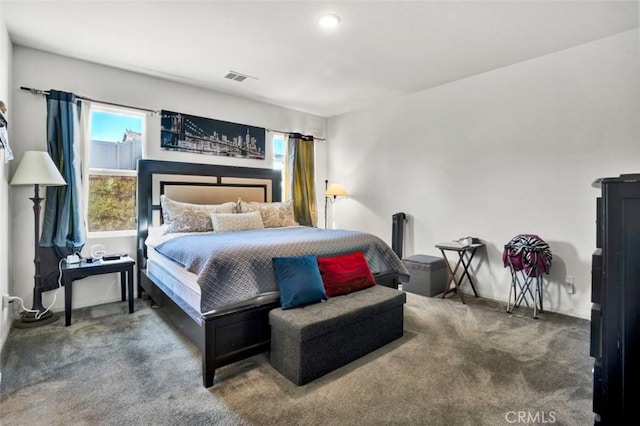 bedroom featuring baseboards, visible vents, and carpet flooring