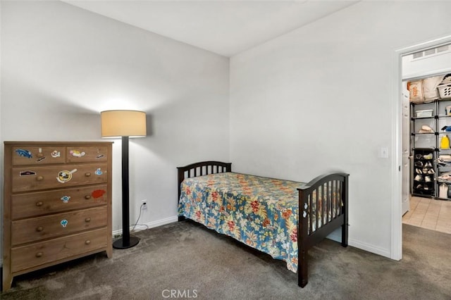 bedroom with baseboards and carpet floors